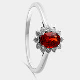 Zafiro naranja talla oval con orla de brillantes con garra compartida